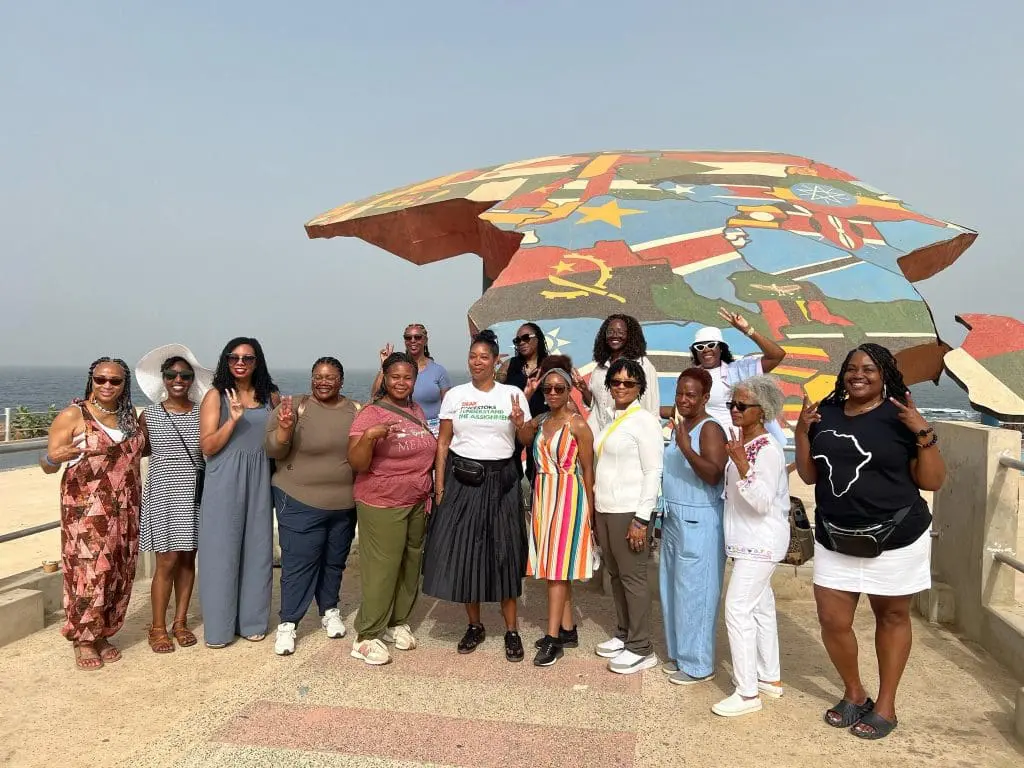 Group of Travel Divas in front of Africa display in Senegal