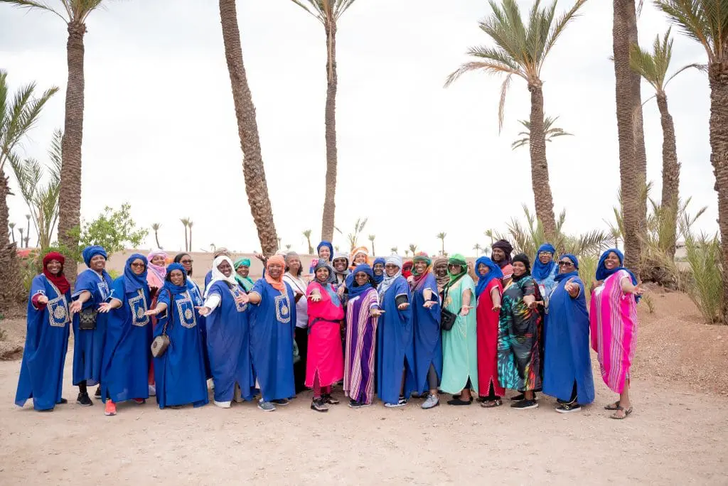 Group of travel divas in desert in Morocco