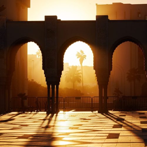 Great mosque of Hassan 2 at sunset in Casablanca, Morocco. Beautiful Arches of the Arab mosque in the sunset, sunlight rays