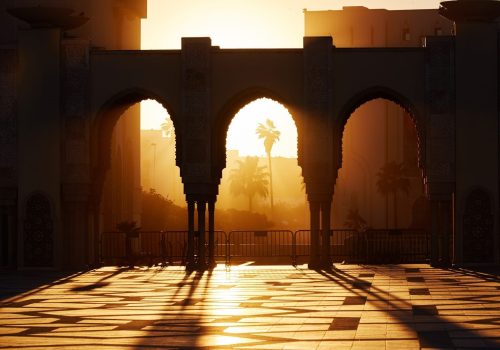 Great mosque of Hassan 2 at sunset in Casablanca, Morocco. Beautiful Arches of the Arab mosque in the sunset, sunlight rays